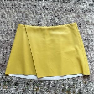 Yellow leather mini skirt
